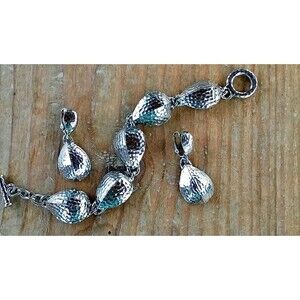 Avon bracelet and clip on earrings hammered silver tone set